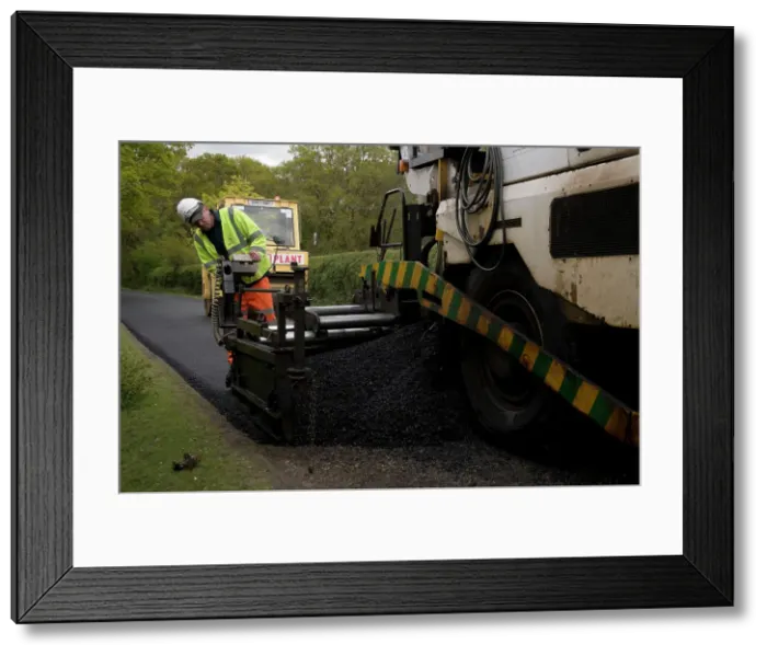 Framed Print : Road resurfacing work repairing potholes Framed Print : Road resurfacing work repairing potholes