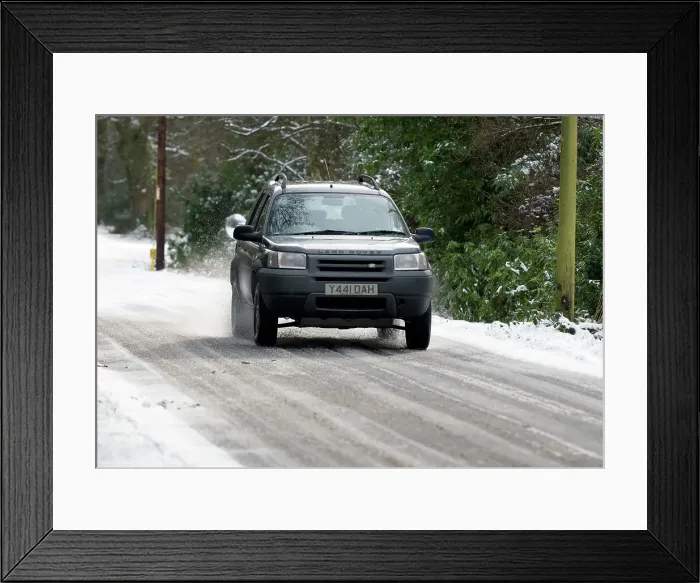 Framed Print : 2001 Land Rover Freelander driving on icy road Framed Print : 2001 Land Rover Freelander driving on icy road