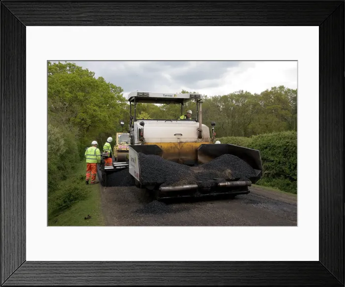 Framed Print : Road resurfacing work repairing potholes Framed Print : Road resurfacing work repairing potholes