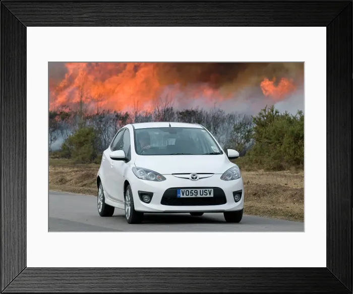 Framed Print : 2010 Mazda 2 Sport, controlled burning in New Forest