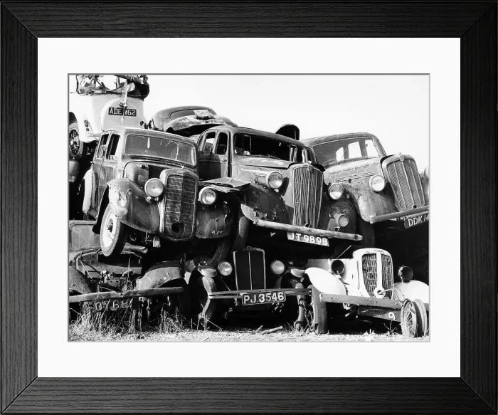 Framed Print : Old cars piled up in a scrapyard, Britain Framed Print : Old cars piled up in a scrapyard, Britain