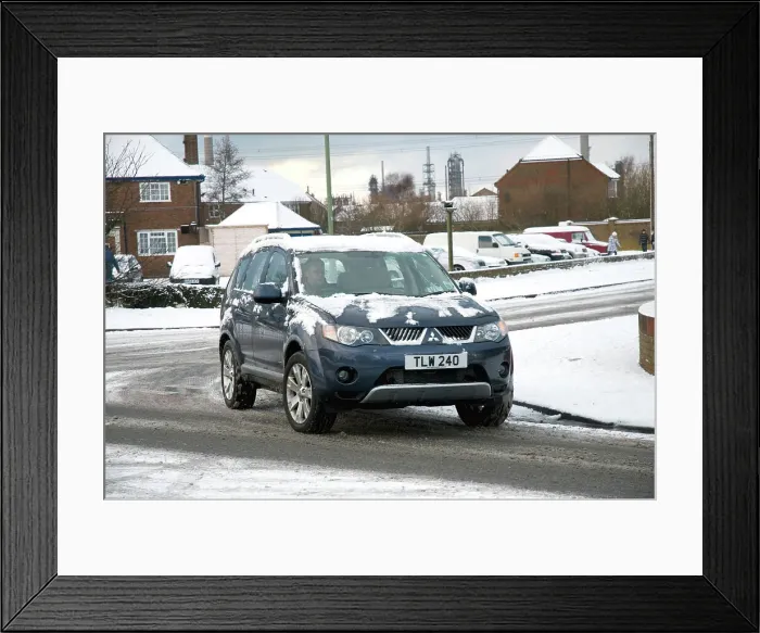 Framed Print : 2008 Mitsubishi Outlander driving in snow Framed Print : 2008 Mitsubishi Outlander driving in snow