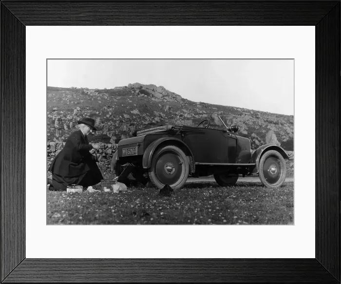 Framed Print : A woman picnicking next to her air-cooled Rover 8, c1919-c1925 Framed Print : A woman picnicking next to her air-cooled Rover 8, c1919-c1925