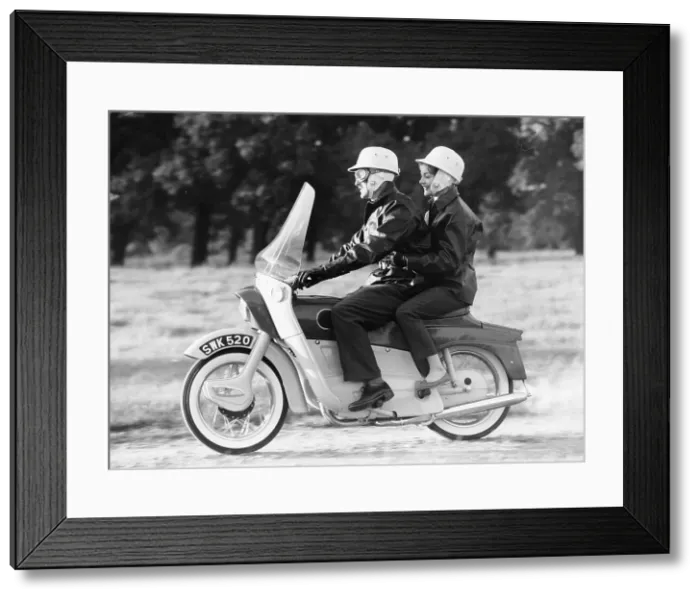 Framed Print : A man and a woman riding an Ariel Leader, 1958 Framed Print : A man and a woman riding an Ariel Leader, 1958