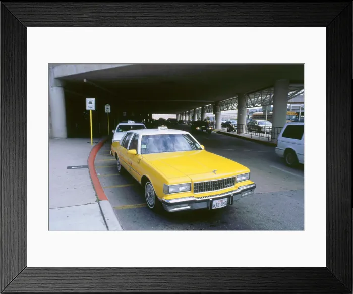 Framed Print : Yellow taxi cab at airport Framed Print : Yellow taxi cab at airport