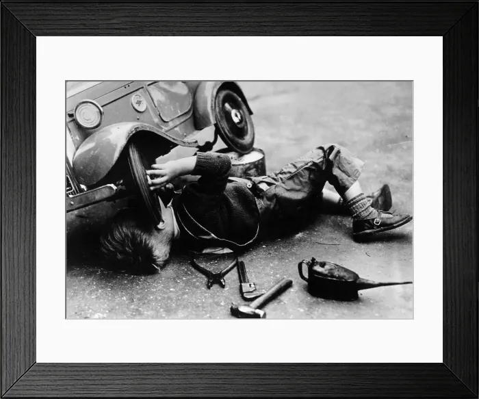 Framed Print : Michael Ware repairing his pedal car Framed Print : Michael Ware repairing his pedal car
