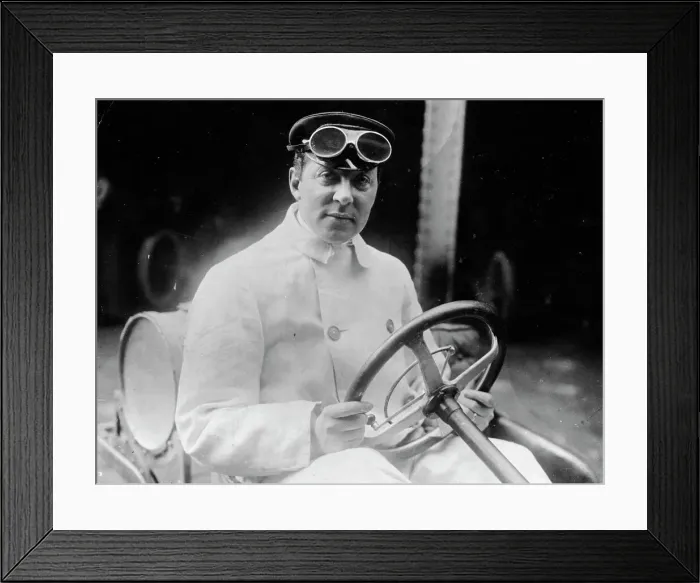 Framed Print : A man at the wheel of his car dressed in a driving coat and goggles Framed Print : A man at the wheel of his car dressed in a driving coat and goggles