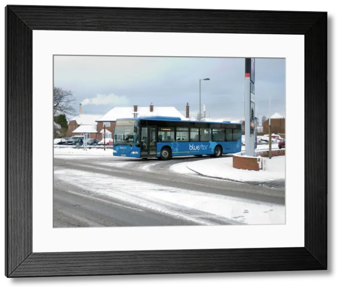 Framed Print : Solent Blue line Bus in snowy weather conditions