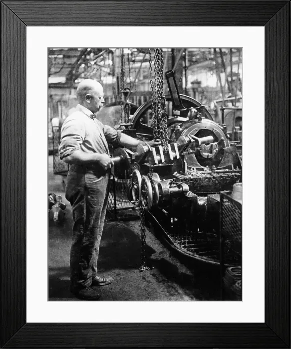 Framed Print : Man operating machinery in a car factory Framed Print : Man operating machinery in a car factory