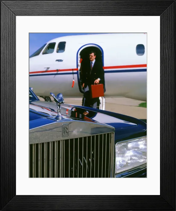 Framed Print : 1987 Rolls Royce Silver Spirit with executive disembarking jet