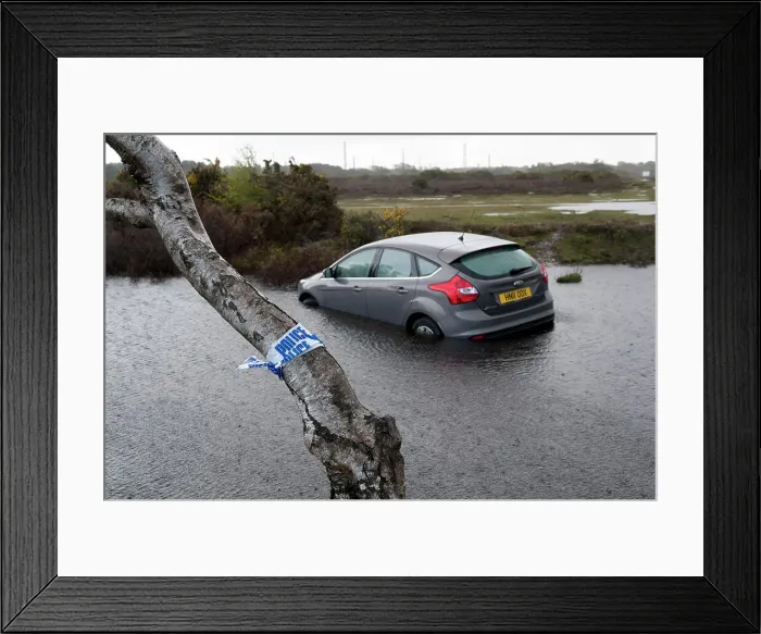 Framed Print : Ford Focus in flooded ditch after losing control on wet road 2012 Framed Print : Ford Focus in flooded ditch after losing control on wet road 2012