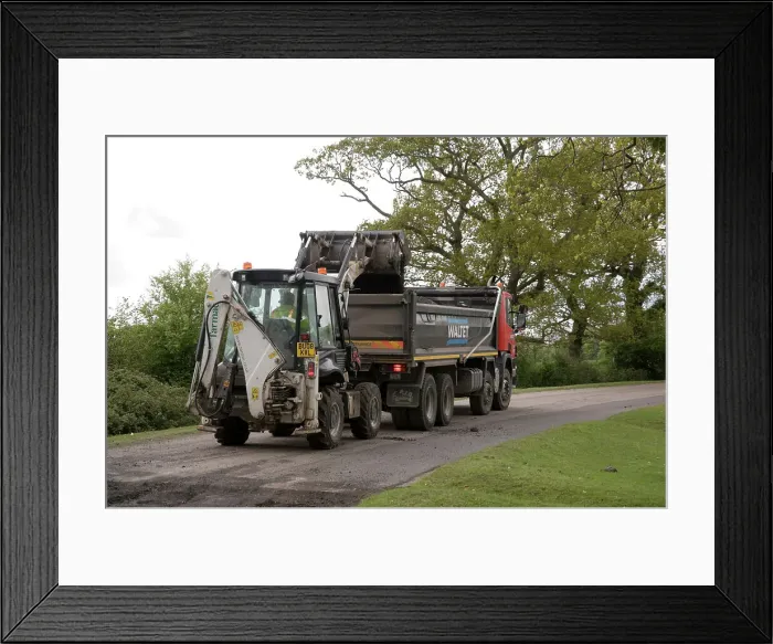 Framed Print : Road resurfacing work repairing potholes Framed Print : Road resurfacing work repairing potholes
