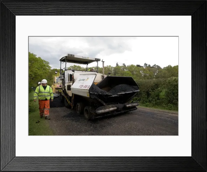 Framed Print : Road resurfacing work repairing potholes Framed Print : Road resurfacing work repairing potholes