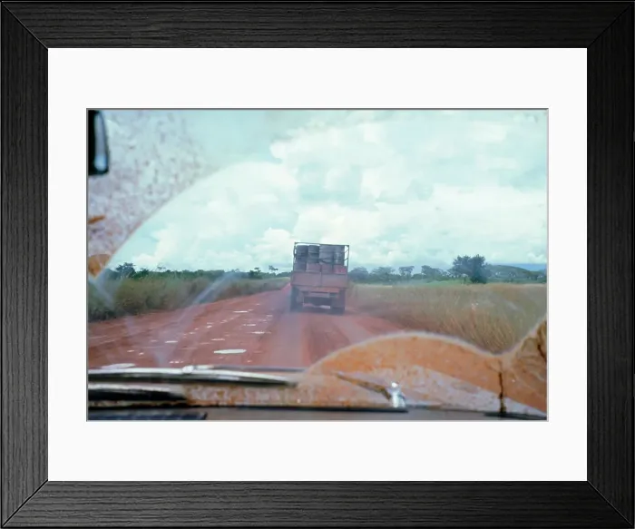 Framed Print : View through muddy windsreen on African dirt road Framed Print : View through muddy windsreen on African dirt road