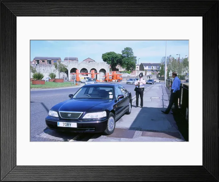 Framed Print : Policeman checking driver documents Framed Print : Policeman checking driver documents