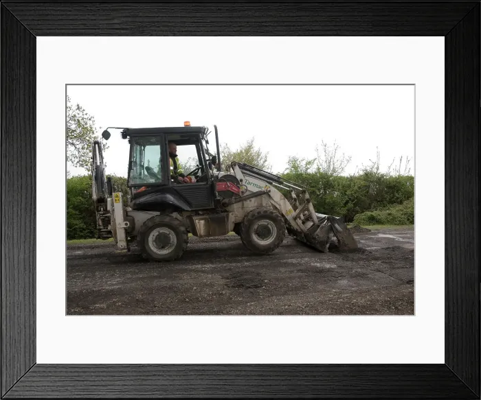 Framed Print : Road resurfacing work repairing potholes