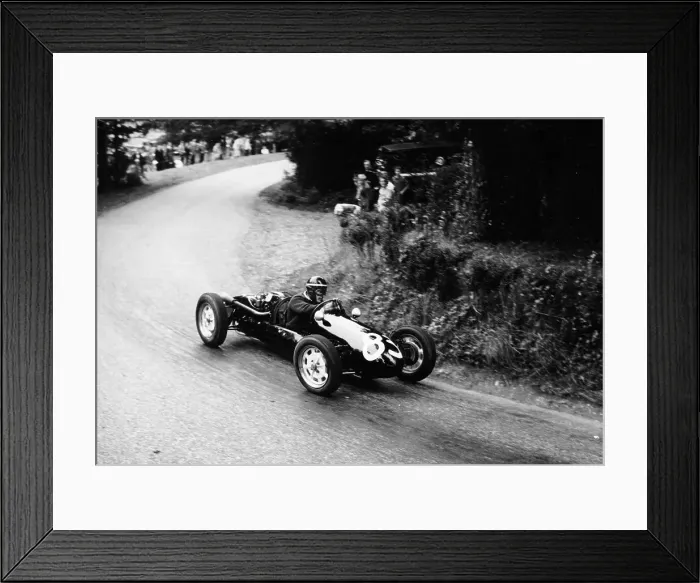 Framed Print : A racing driver speeding round a bend, Harleyford Hill Climb, Buckinghamshire, (c1950-c1960?) Framed Print : A racing driver speeding round a bend, Harleyford Hill Climb, Buckinghamshire, (c1950-c1960?)