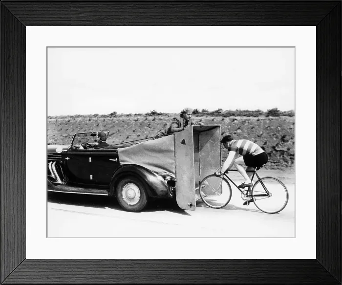 Framed Print : Cyclist training behind an Auburn car, c1935 Framed Print : Cyclist training behind an Auburn car, c1935