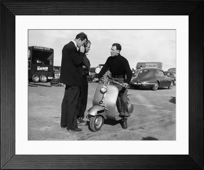 Framed Print : Stirling Moss on a Vespa scooter, Goodwood, April 1952 Framed Print : Stirling Moss on a Vespa scooter, Goodwood, April 1952