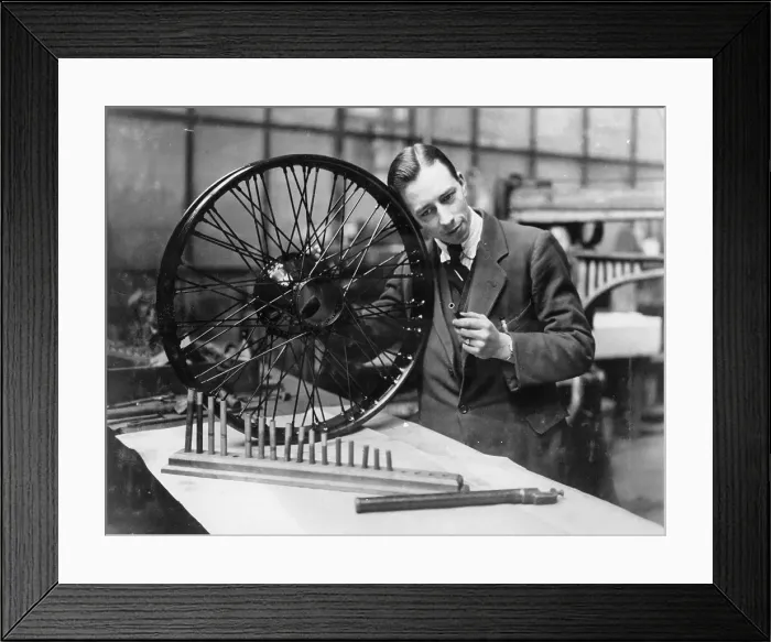 Framed Print : A man in a workshop with a wheel Framed Print : A man in a workshop with a wheel