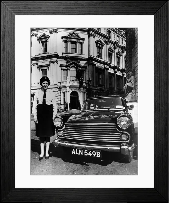Framed Print : Female chauffeur standing by a 1964 Morris Oxford, 1964 Framed Print : Female chauffeur standing by a 1964 Morris Oxford, 1964