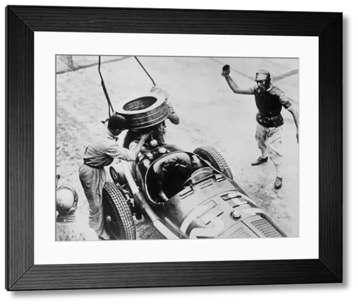 Framed Print : Tazio Nuvolari waiting for his car to be refuelled, c1930s(?)