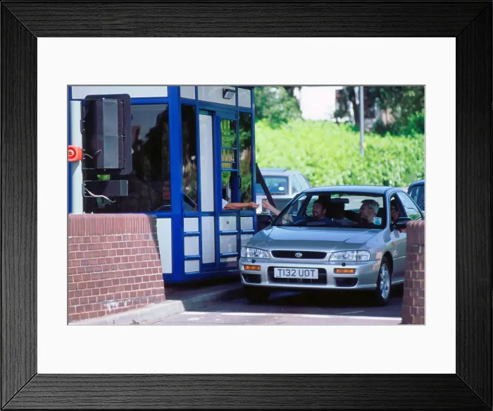Framed Print : Subaru using toll booth on Itchen bridge, Southampton Framed Print : Subaru using toll booth on Itchen bridge, Southampton