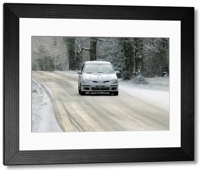 Framed Print : 2003 Nissan Almera driving on icy road in winter Framed Print : 2003 Nissan Almera driving on icy road in winter