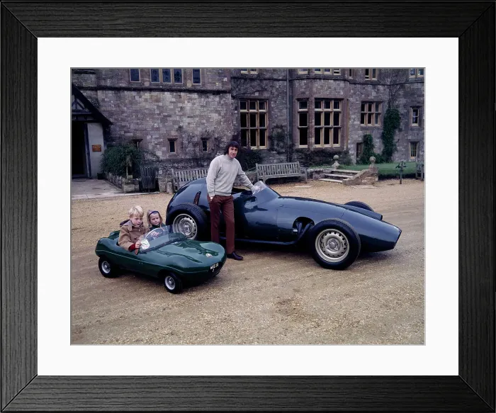 Framed Print : Jackie Stewart posing with a 1957 BRM Framed Print : Jackie Stewart posing with a 1957 BRM