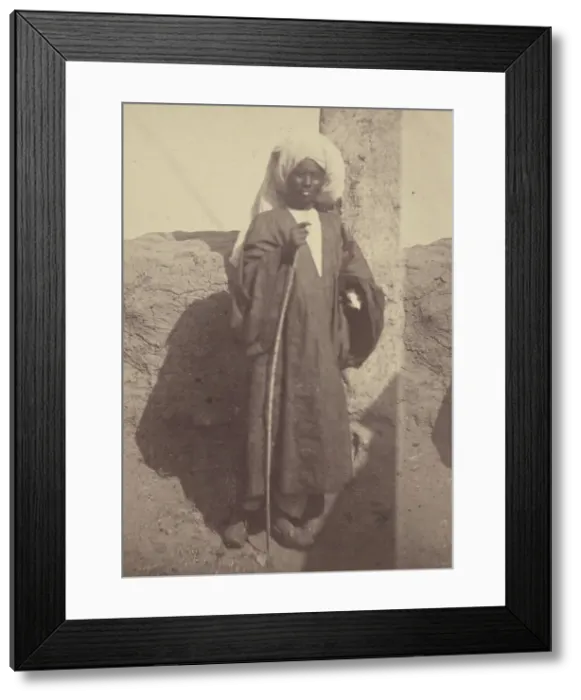 Framed Print : Portrait of a Young North African Man Standing Against a Pillar, 1865. Creator: Theodule Deveria