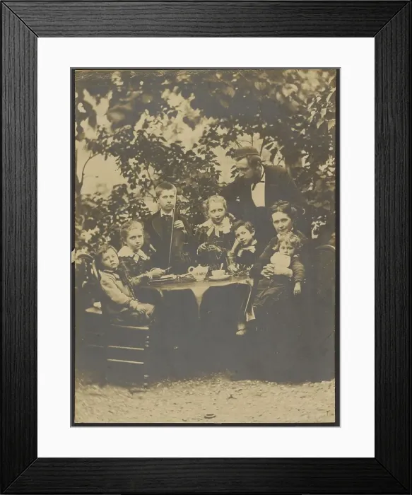 Framed Print : Group portrait around table, 1880-1890. Creator: Victor Dix