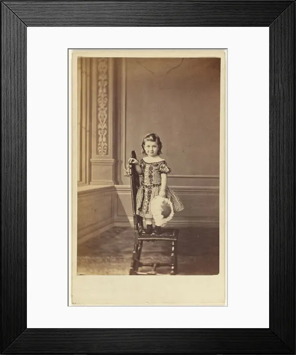 Framed Print : Little girl standing on a chair, 1865-1875. Creator: Frederick Downer & Sons Framed Print : Little girl standing on a chair, 1865-1875. Creator: Frederick Downer & Sons