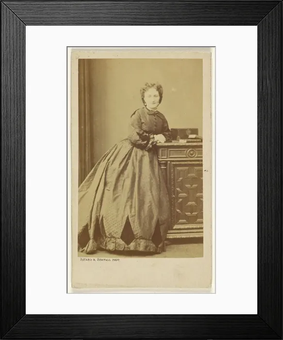 Framed Print : Unidentified woman standing, leaning against a credenza, about 1861. Creator: Bayard & Bertall Framed Print : Unidentified woman standing, leaning against a credenza, about 1861. Creator: Bayard & Bertall
