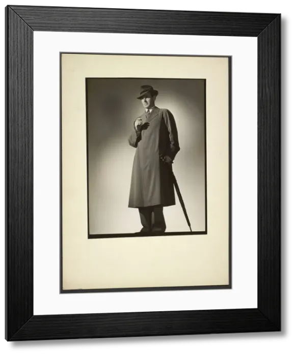 Framed Print : Man modeling trench coat, about 1943. Creator: Gunther Krampf Framed Print : Man modeling trench coat, about 1943. Creator: Gunther Krampf