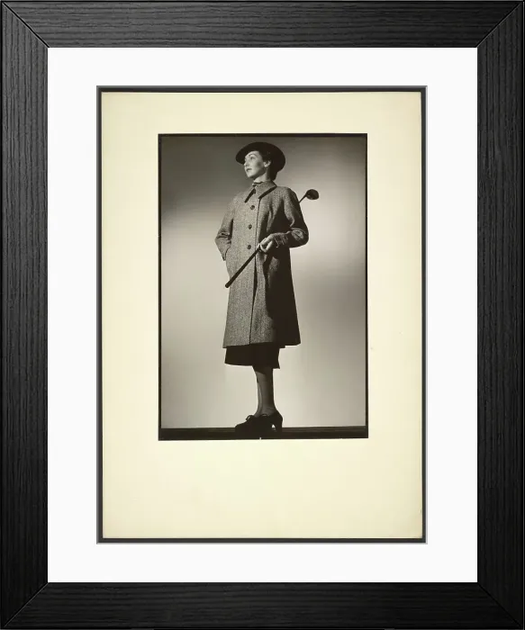 Framed Print : Woman modeling coat with golf club, early 1940s. Creator: Gunther Krampf Framed Print : Woman modeling coat with golf club, early 1940s. Creator: Gunther Krampf