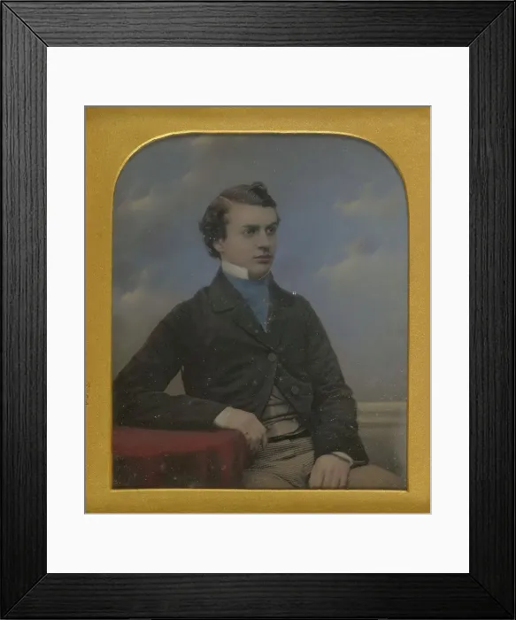 Framed Print : Portrait of a Young Man Seated at Table, about 1852. Creator: Richard Beard