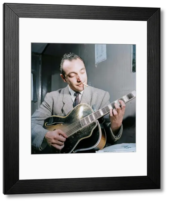 Framed Print : Portrait of Django Reinhardt, Aquarium, New York, N.Y. ca. Nov. 1946. Creator: William Paul Gottlieb Framed Print : Portrait of Django Reinhardt, Aquarium, New York, N.Y. ca. Nov. 1946. Creator: William Paul Gottlieb