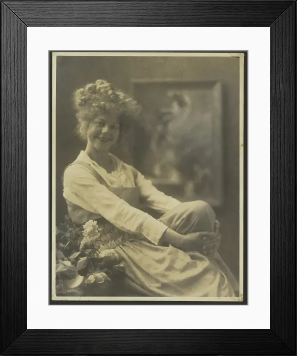 Framed Print : Portrait of a Woman in Pinafore with Flowers, 1907-1943. Creator: Louis Fleckenstein Framed Print : Portrait of a Woman in Pinafore with Flowers, 1907-1943. Creator: Louis Fleckenstein