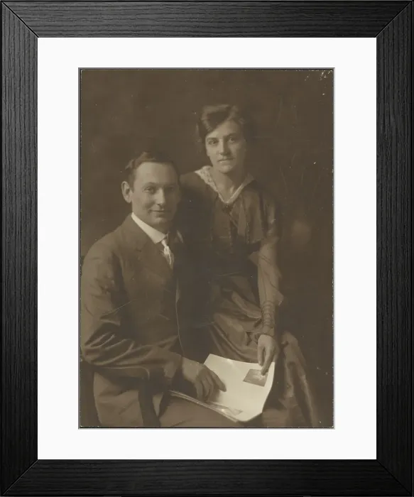 Framed Print : Portrait of a Man and a Woman Holding Magazine, 1907-1943. Creator: Louis Fleckenstein Framed Print : Portrait of a Man and a Woman Holding Magazine, 1907-1943. Creator: Louis Fleckenstein