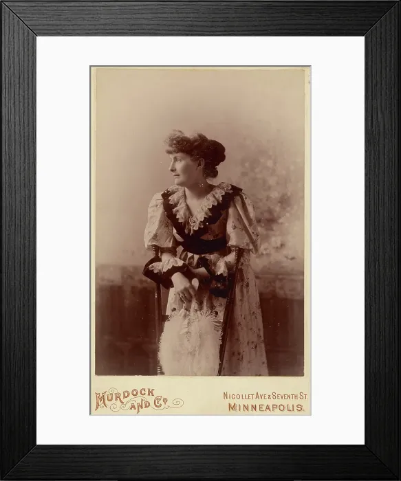 Framed Print : Unidentified woman in profile, leaning on a chair, holding a feather fan, about 1890. Creator: Murdock and Company Framed Print : Unidentified woman in profile, leaning on a chair, holding a feather fan, about 1890. Creator: Murdock and Company