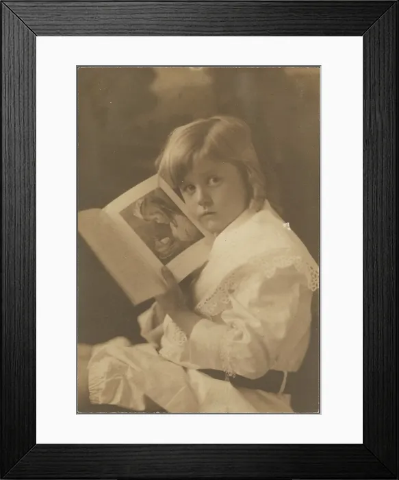 Framed Print : Portrait of Child Holding Book Open to Like Illustration, 1907-1943. Creator: Louis Fleckenstein Framed Print : Portrait of Child Holding Book Open to Like Illustration, 1907-1943. Creator: Louis Fleckenstein