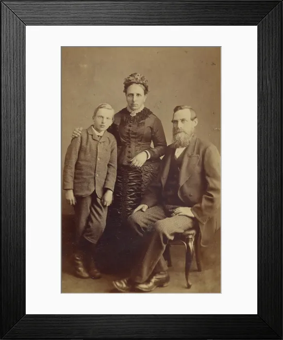 Framed Print : Portrait of an unidentified family: mother and son standing, bearded father seated, 1865-1875. Creator: John McKean Framed Print : Portrait of an unidentified family: mother and son standing, bearded father seated, 1865-1875. Creator: John McKean