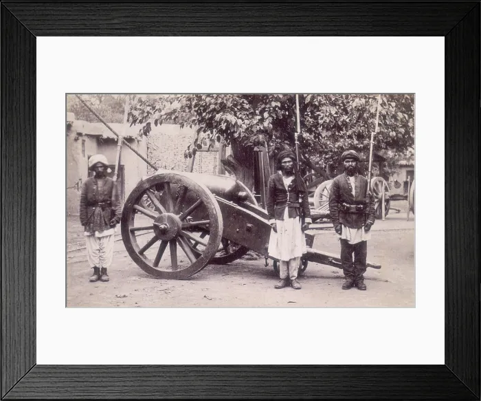 Framed Print : Three Afghan soldiers standing next to a cannon, Afghanistan, 1880s. Creator: Unknown Framed Print : Three Afghan soldiers standing next to a cannon, Afghanistan, 1880s. Creator: Unknown