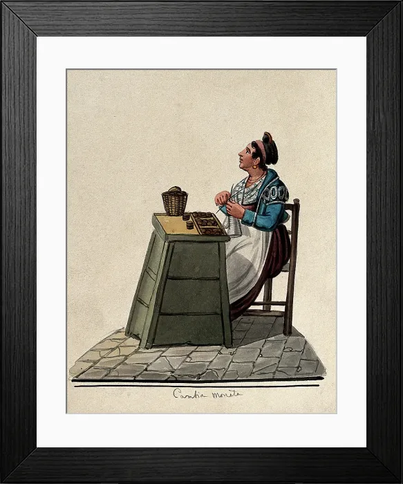 Framed Print : A women is sitting knitting at a table in the street with money on it in trays. Creator: Unknown Framed Print : A women is sitting knitting at a table in the street with money on it in trays. Creator: Unknown