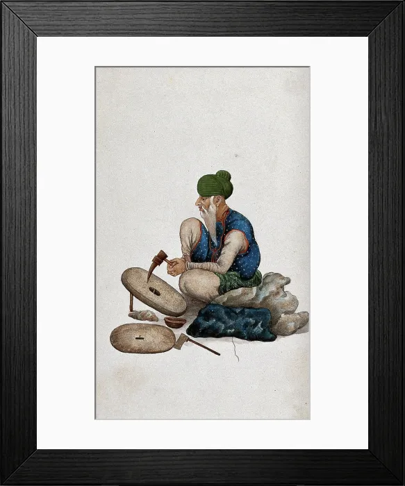 Framed Print : A man making grindstones, (between 1800 and 1899?). Creator: Unknown Framed Print : A man making grindstones, (between 1800 and 1899?). Creator: Unknown