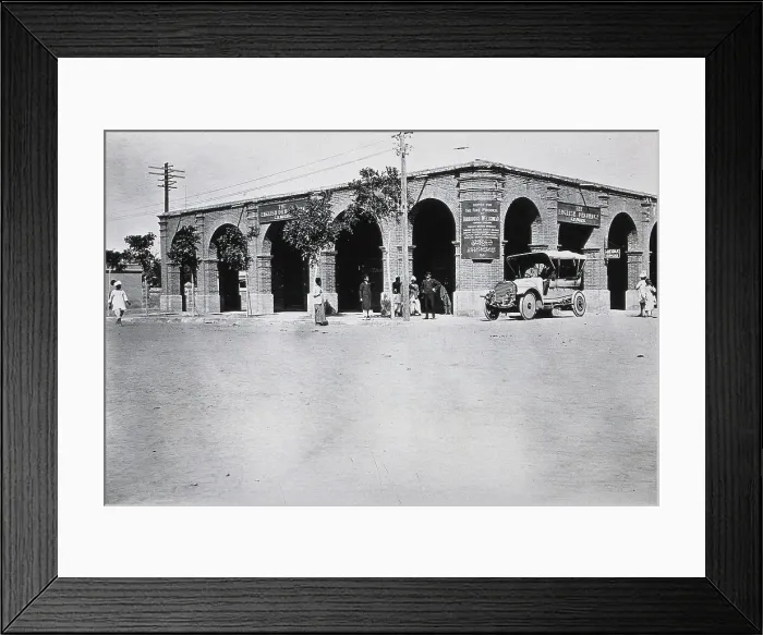Framed Print : Two men in a car outside the Wellcome pharmaceutical depot in the Middle East, c1910.. Creator: Unknown Framed Print : Two men in a car outside the Wellcome pharmaceutical depot in the Middle East, c1910.. Creator: Unknown