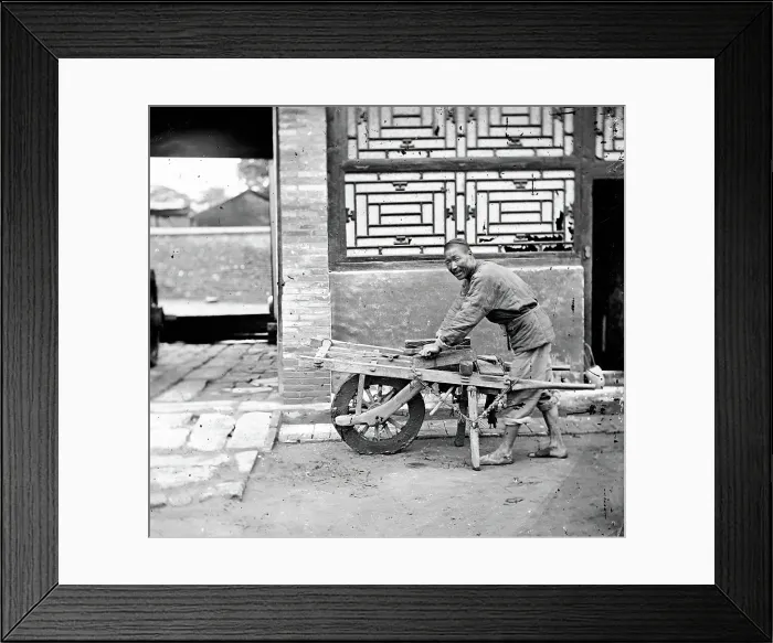 Framed Print : Peking, Pechili province, China: a knife-grinder, 1869. Creator: John Thomson Framed Print : Peking, Pechili province, China: a knife-grinder, 1869. Creator: John Thomson