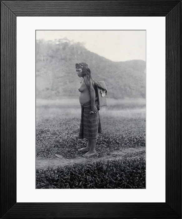 Framed Print : Sarawak: a Kayan woman carrying her child in a sling, c19th century. Creator: Unknown Framed Print : Sarawak: a Kayan woman carrying her child in a sling, c19th century. Creator: Unknown