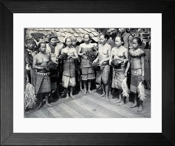 Framed Print : Sarawak: Sea Dayak men at a head feast, c1900. Creator: Unknown Framed Print : Sarawak: Sea Dayak men at a head feast, c1900. Creator: Unknown