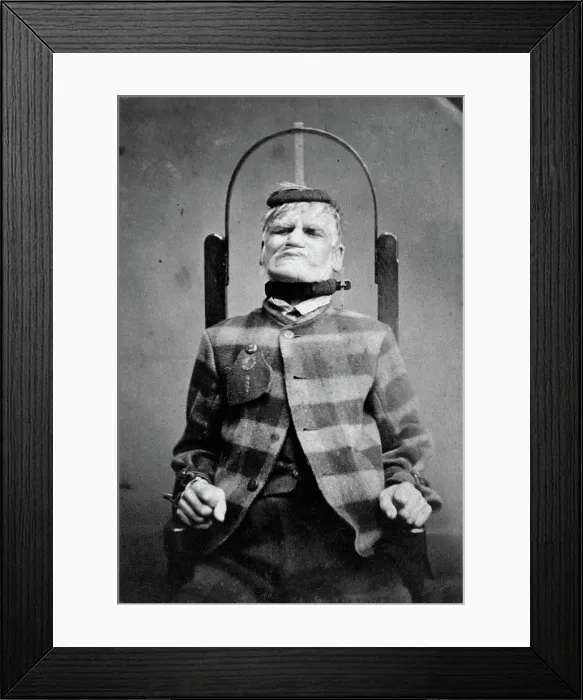 Framed Print : Wakefield Prison, Yorkshire: an elderly man, struggling against the restraint-chair in... c1869. Creator: Unknown Framed Print : Wakefield Prison, Yorkshire: an elderly man, struggling against the restraint-chair in... c1869. Creator: Unknown